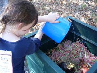 thumb_girl_dumping_compost.jpg