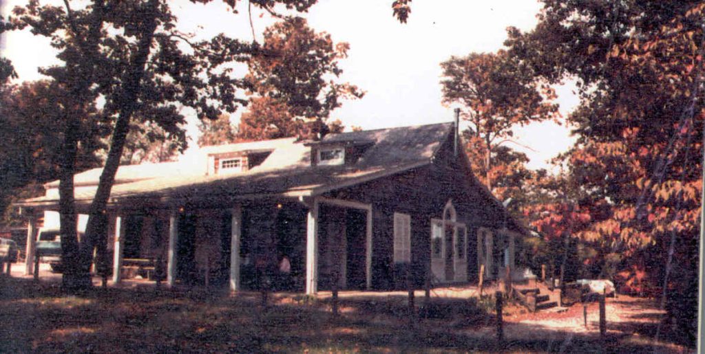 Older building with white columns. 