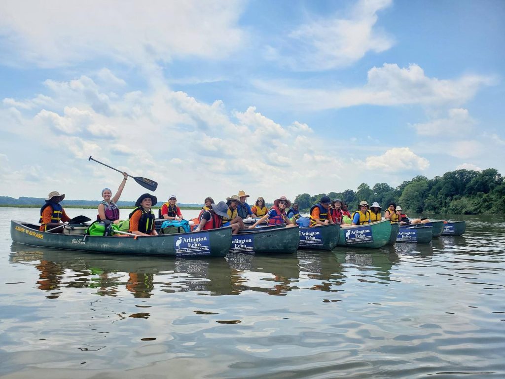 Students in canoes on the water.
